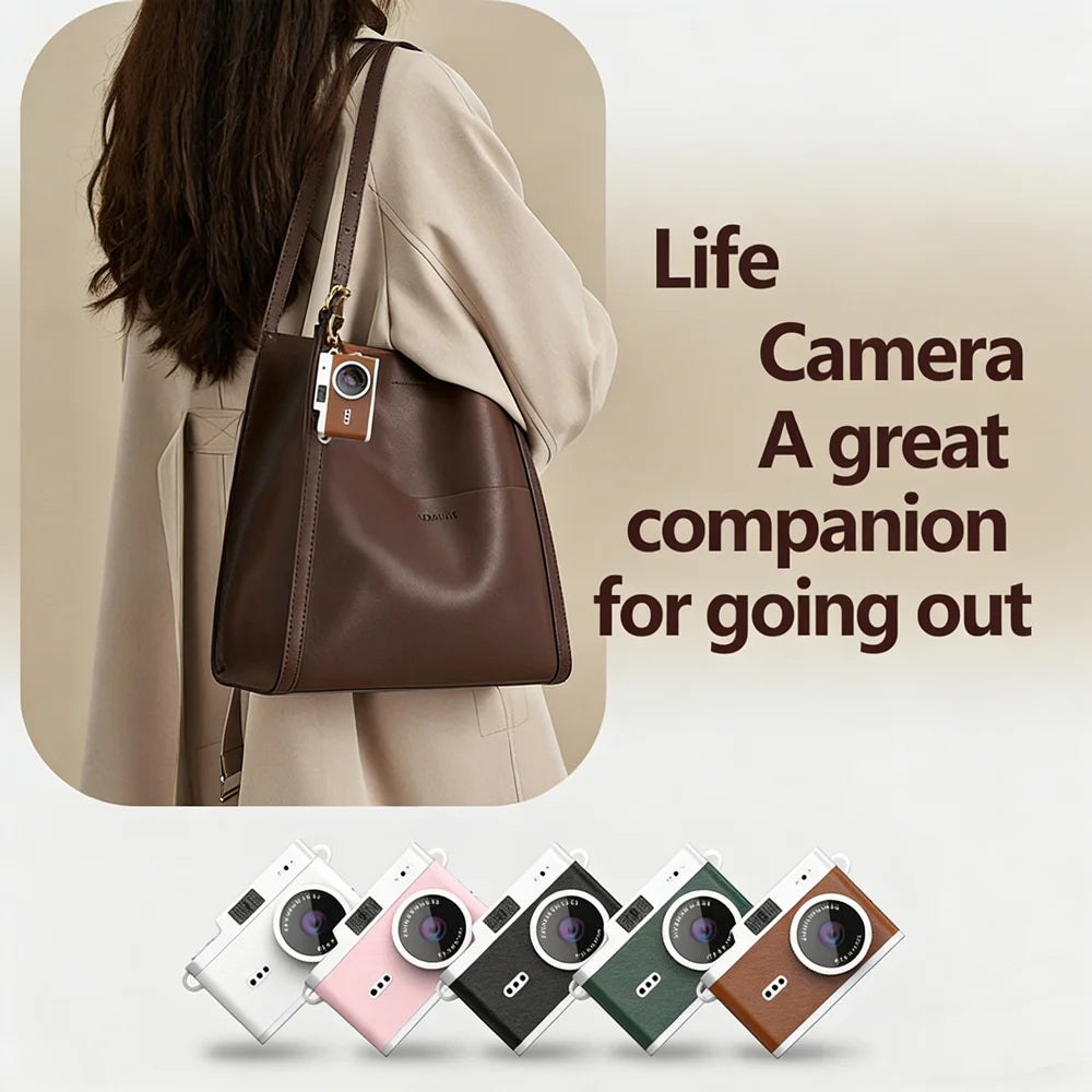 Retro pendant mini camera hanging from a leather bag